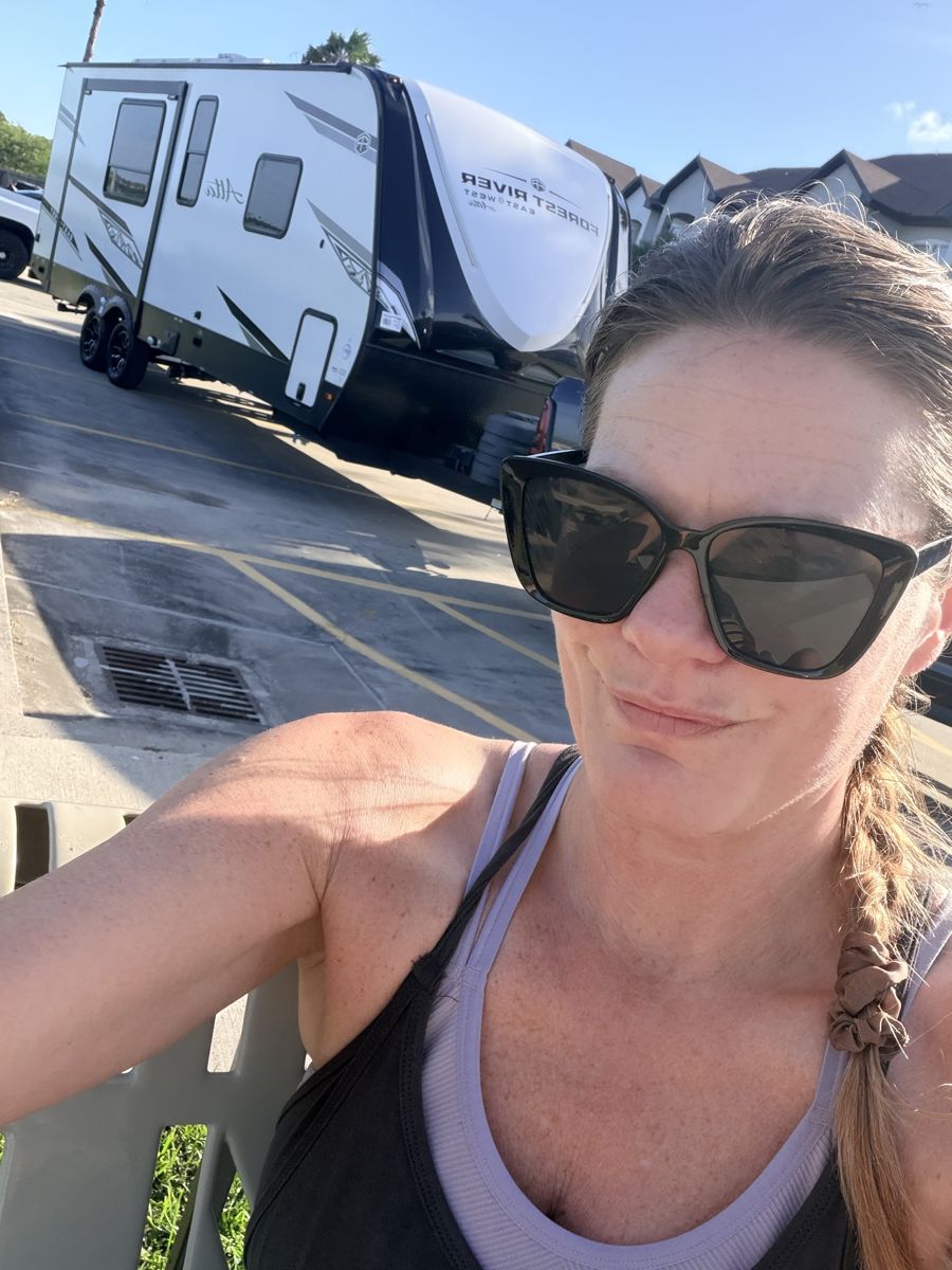 Krissy taking a selfie in front of her RV
