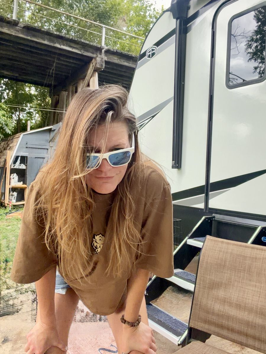 Krissy in white sunglasses by the RV